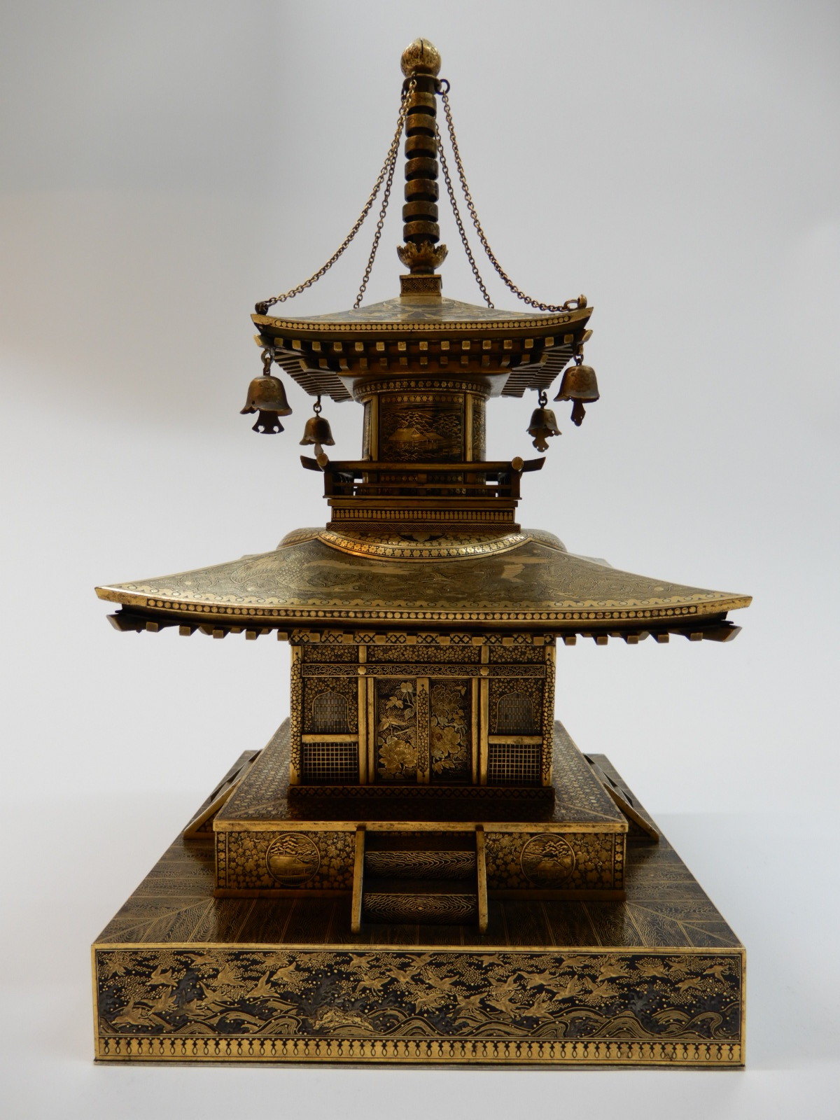 An Inlaid Iron Cabinet Modelled as a Shrine, attributed to the Komai Company of Kyoto, Meiji era, late 19th/early 20th century, 12 x 6 ½ in. (30.5 x 16.7 cm.) Sale: Fine Japanese Art, 7 November 2019, lot 211. Image courtesy of Bonhams.